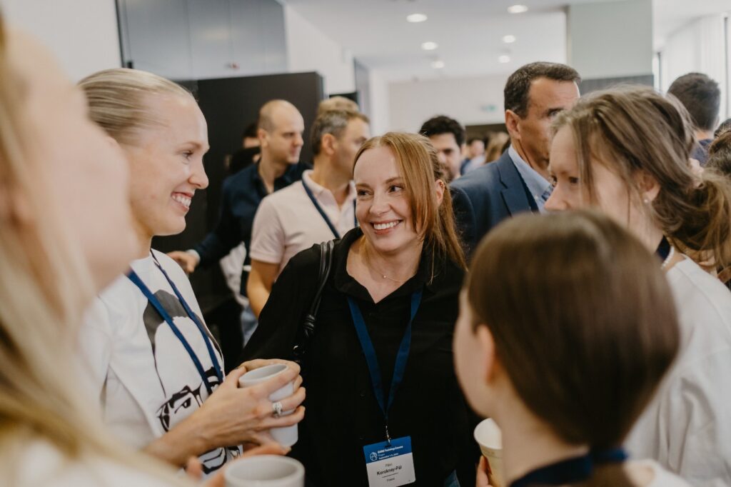 Networking during a coffee break at a Prague conference